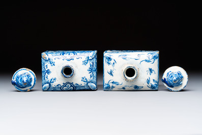 A pair of blue and white Dutch Delft square tea caddies and covers, 18th C.