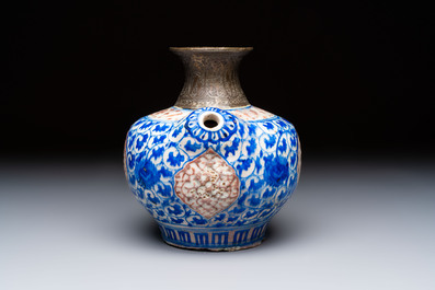 A Safavid blue, white and red pottery hookah base or kendi, Kirman, Persia, 17th C.