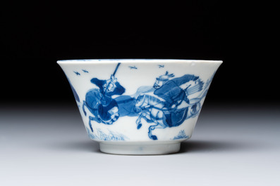 A Chinese blue and white 'Hunting Scene' cup and saucer, Kangxi