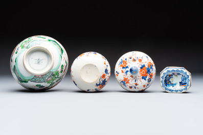 Three Chinese blue and white, famille rose and black-glazed covered teapots, a salt, an Imari-style covered bowl, and a famille verte bowl, 18th C.