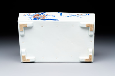 A Chinese blue, white and copper-red rectangular jardini&egrave;re with birds among flowering branches, 20th C.