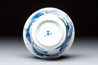 A Chinese blue and white 'Hunting Scene' cup and saucer, Kangxi