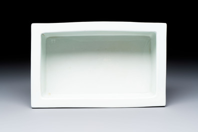 A Chinese blue, white and copper-red rectangular jardini&egrave;re with birds among flowering branches, 20th C.