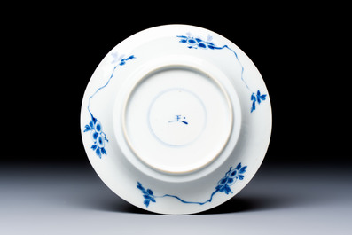 A Chinese blue and white 'Hunting Scene' cup and saucer, Kangxi