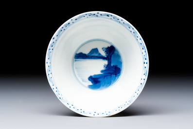 A Chinese blue and white 'Hunting Scene' cup and saucer, Kangxi