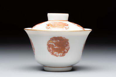 A fine Chinese iron-red gilt-decorated covered teabowl with a stand, Guangxu mark and of the period