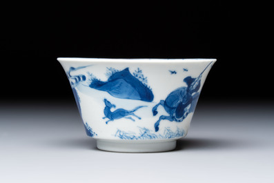 A Chinese blue and white 'Hunting Scene' cup and saucer, Kangxi