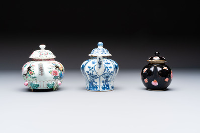 Three Chinese blue and white, famille rose and black-glazed covered teapots, a salt, an Imari-style covered bowl, and a famille verte bowl, 18th C.
