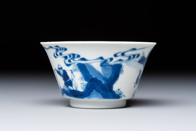 A Chinese blue and white 'Hunting Scene' cup and saucer, Kangxi