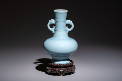 A Chinese claire-de-lune handled vase, with a wooden stand and its original hongmu box, Yongzheng mark, Republic
