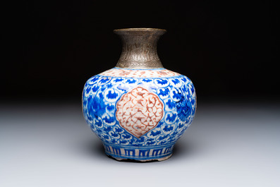 A Safavid blue, white and red pottery hookah base or kendi, Kirman, Persia, 17th C.