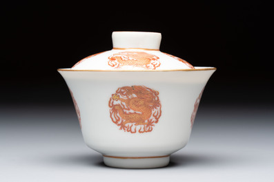 A fine Chinese iron-red gilt-decorated covered teabowl with a stand, Guangxu mark and of the period
