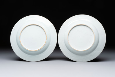 A pair of Chinese famille rose 'Winged Putti' plates, Yongzheng/Qianlong