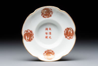 A fine Chinese iron-red gilt-decorated covered teabowl with a stand, Guangxu mark and of the period