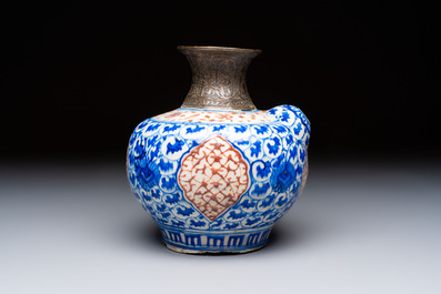 A Safavid blue, white and red pottery hookah base or kendi, Kirman, Persia, 17th C.