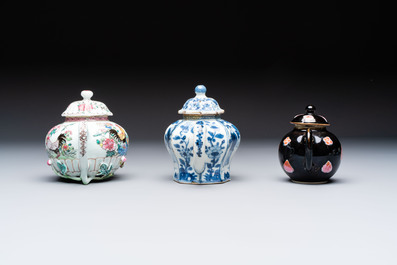 Three Chinese blue and white, famille rose and black-glazed covered teapots, a salt, an Imari-style covered bowl, and a famille verte bowl, 18th C.