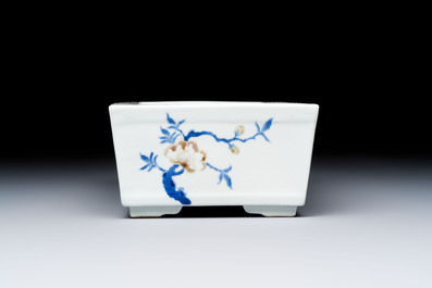 A Chinese blue, white and copper-red rectangular jardini&egrave;re with birds among flowering branches, 20th C.