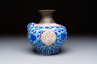 A Safavid blue, white and red pottery hookah base or kendi, Kirman, Persia, 17th C.