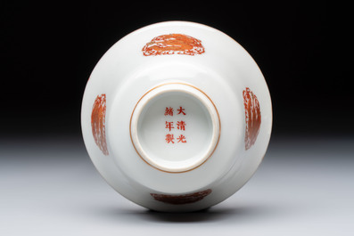 A fine Chinese iron-red gilt-decorated covered teabowl with a stand, Guangxu mark and of the period