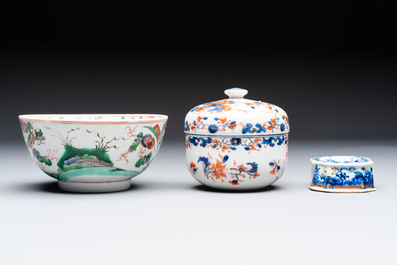 Three Chinese blue and white, famille rose and black-glazed covered teapots, a salt, an Imari-style covered bowl, and a famille verte bowl, 18th C.
