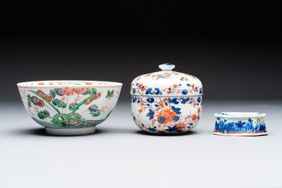 Three Chinese blue and white, famille rose and black-glazed covered teapots, a salt, an Imari-style covered bowl, and a famille verte bowl, 18th C.