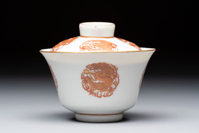 A fine Chinese iron-red gilt-decorated covered teabowl with a stand, Guangxu mark and of the period
