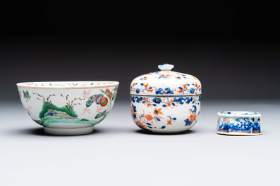 Three Chinese blue and white, famille rose and black-glazed covered teapots, a salt, an Imari-style covered bowl, and a famille verte bowl, 18th C.