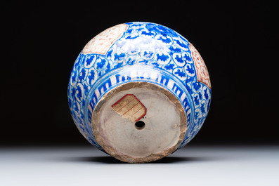A Safavid blue, white and red pottery hookah base or kendi, Kirman, Persia, 17th C.