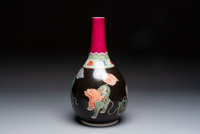 A rare Chinese famille verte black- and ruby-ground 'Buddhist Lions' vase, Kangxi