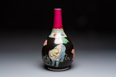 A rare Chinese famille verte black- and ruby-ground 'Buddhist Lions' vase, Kangxi