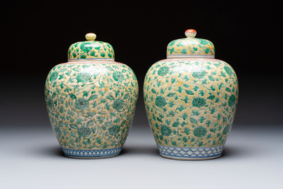 A rare pair of Chinese famille verte yellow-ground 'Flower Scroll' covered vases, Kangxi