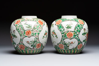 A pair of Chinese famille verte 'Floral' jars with wooden covers, 19th C.
