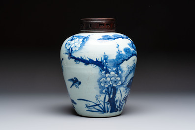A Chinese blue and white 'Three Friends of Winter' jar with an openworked wooden cover, Transitional period