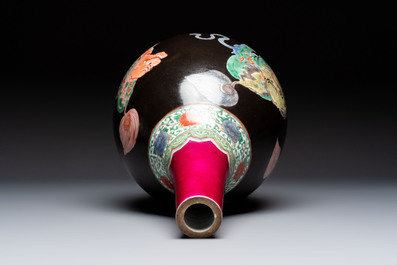 A rare Chinese famille verte black- and ruby-ground 'Buddhist Lions' vase, Kangxi