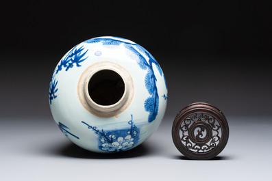 A Chinese blue and white 'Three Friends of Winter' jar with an openworked wooden cover, Transitional period