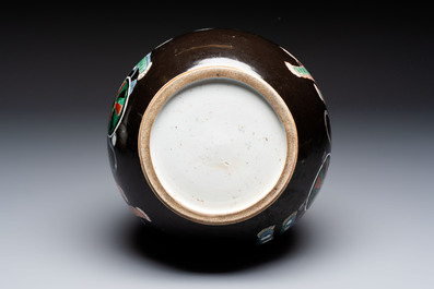 A rare Chinese famille verte black- and ruby-ground 'Buddhist Lions' vase, Kangxi