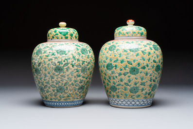 A rare pair of Chinese famille verte yellow-ground 'Flower Scroll' covered vases, Kangxi