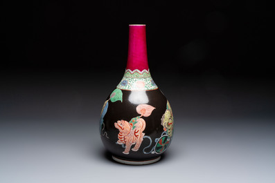 A rare Chinese famille verte black- and ruby-ground 'Buddhist Lions' vase, Kangxi