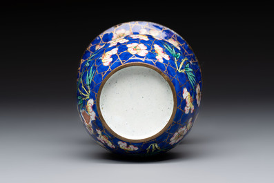A Chinese Canton enamel 'Prunus on Cracked Ice' spittoon and two snuff dishes, 19th C.