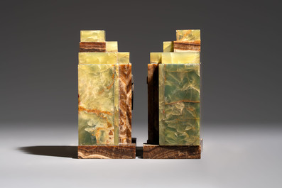 Georges Lavroff (1895&ndash;1991): An Art Deco three-piece copper-alloy-mounted green and brown onyx mantelpiece garniture, ca. 1900
