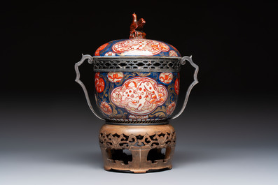 Two Japanese Imari covered bowls, one mounted in silver and wood and the other with gilt-bronze mounts, Meiji, 19th C.