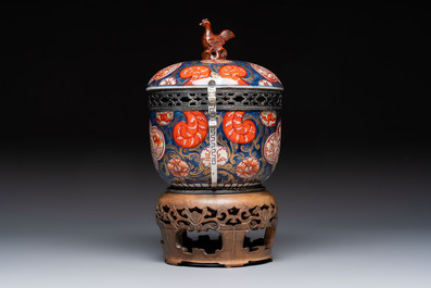Two Japanese Imari covered bowls, one mounted in silver and wood and the other with gilt-bronze mounts, Meiji, 19th C.