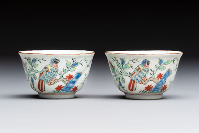 Two Dutch-decorated Chinese cups and saucers with parrots among flowering branches, 18th C.