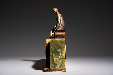 Georges Lavroff (1895&ndash;1991): An Art Deco three-piece copper-alloy-mounted green and brown onyx mantelpiece garniture, ca. 1900