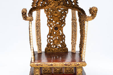 An exceptional Vietnamese gilt-lacquered wood and ivory 'Dragon and Phoenix' throne-shaped altar, 18/19th C.