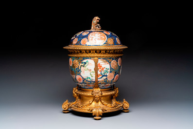 Two Japanese Imari covered bowls, one mounted in silver and wood and the other with gilt-bronze mounts, Meiji, 19th C.