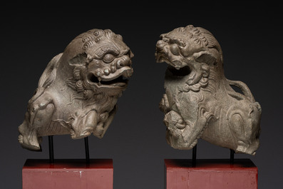 A pair of Chinese carved stone Buddhist lions on later red-lacquered wooden stands, Fujian, Qing