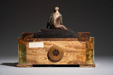 Georges Lavroff (1895&ndash;1991): An Art Deco three-piece copper-alloy-mounted green and brown onyx mantelpiece garniture, ca. 1900