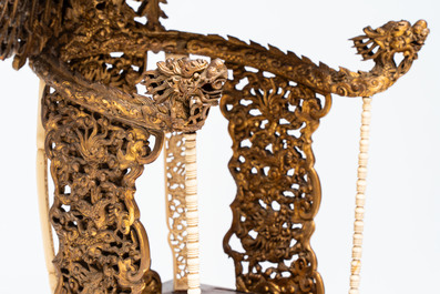 An exceptional Vietnamese gilt-lacquered wood and ivory 'Dragon and Phoenix' throne-shaped altar, 18/19th C.