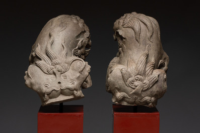 A pair of Chinese carved stone Buddhist lions on later red-lacquered wooden stands, Fujian, Qing